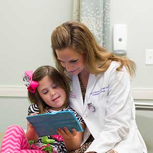 Patient and provider looking at an IPad